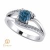 Inel de logodna din aur cu diamant albastru si diamante incolore ES102